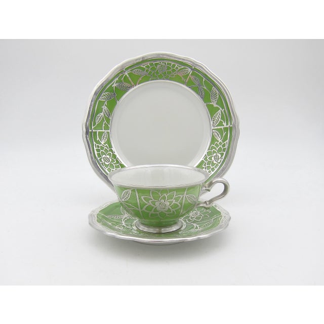 A vintage silver overlay porcelain demitasse cup, saucer, and plate trio by Manfred Veyhl and Rosenthal Selb of Germany,...