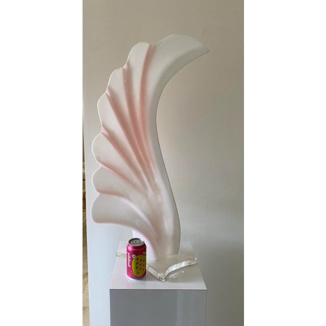 Channel the bold elegance of 1980s design with this dramatic pink and white acrylic table lamp attributed to Rougier (no...