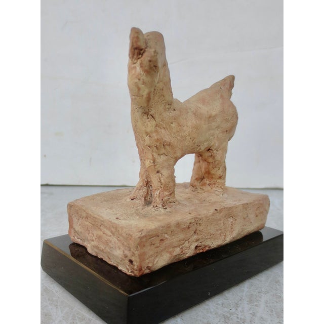 Lively study of a small goat. Art Brut in the execution of large volumes of hips, bent neck, and head turn. Lively in...