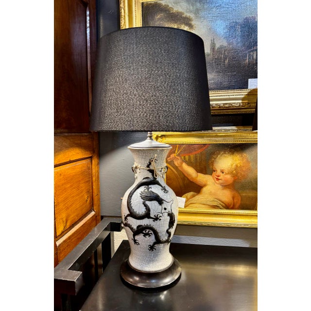 This is a very large and stunning pair of late 19th century Chinese Pale Celadon Crackle Glazed Dragon and Flaming Pearl...