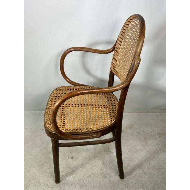 For sale is this very nice vintage arm chair in the style of thonet