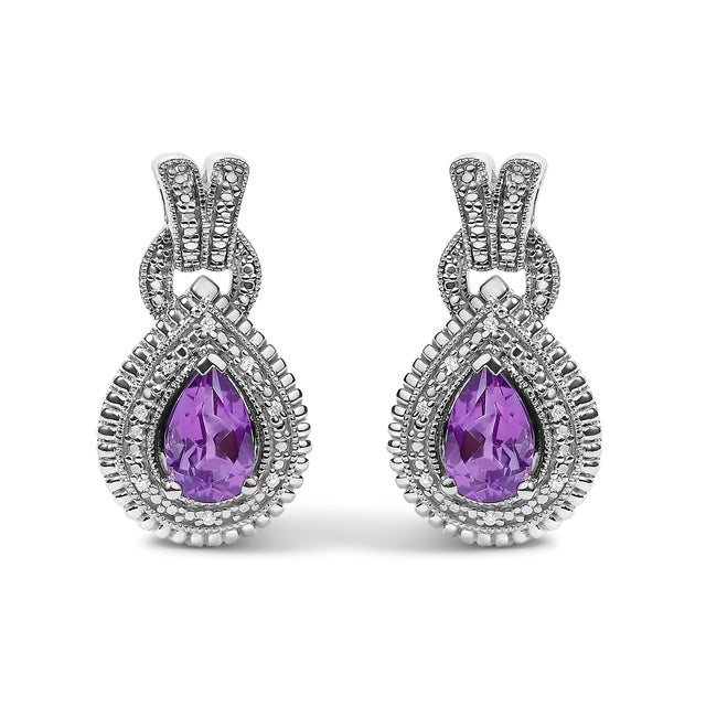 Indulge in the elegance of timeless sophistication with these stunning .925 sterling silver earrings, each featuring a...