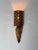 A distinctive swedish wall sconce combining a delicately patterned birch bark shade with a sculptural piece of naturally...