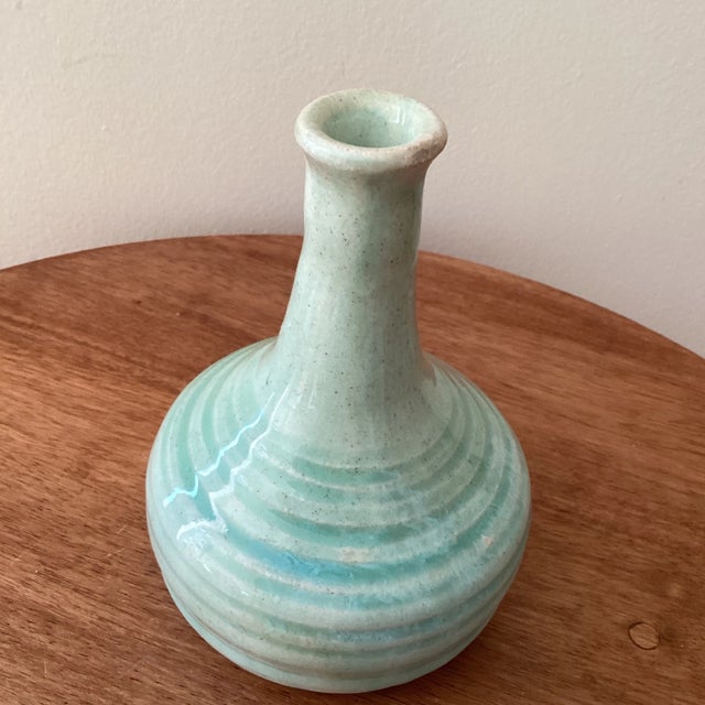 Circular flared rim ceramic vase, having pale blue and off-white concentric band decoration. Marked on the bottom R 3/92.