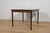 The square extendable table made of rosewood was produced in Denmark in the 1960s. The table has reinforced, profiled...