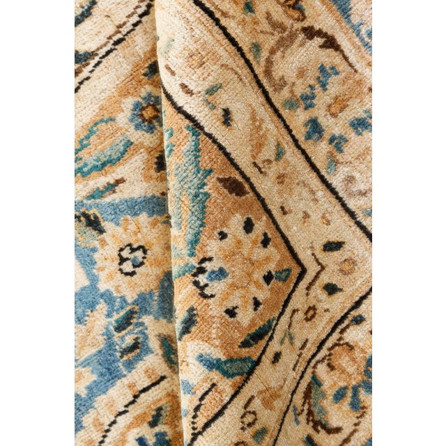 An early 20th century Northwest Persian Kirman antique rug with various cartouches forms overall filled with vinery,...