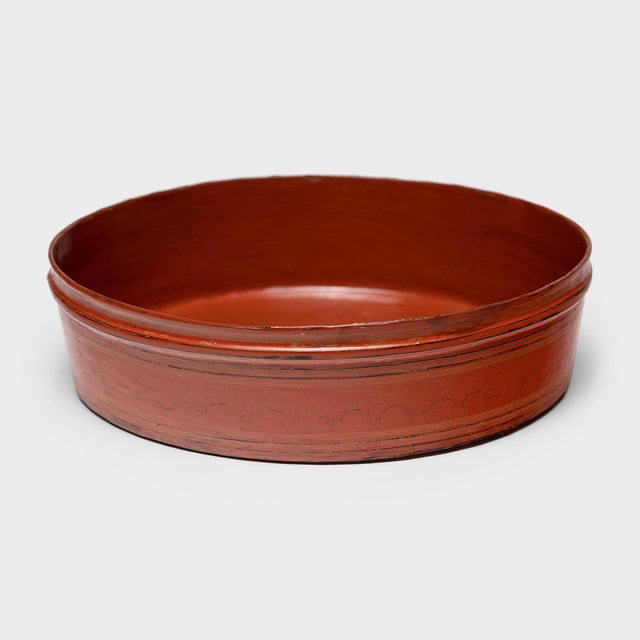 This red lacquer tray is one tier of an early 20th century Burmese stacking betel box (kun-it). A blend of betel leaves,...