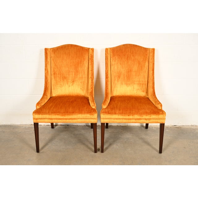 A gorgeous pair of Regency style armchairs or dining captain chairs By Kittinger USA, Circa 1960s Carved mahogany frames,...