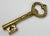 The key to my....bottle? Detailed brass key bottle opener. Hole for hanging if desired. Would be lovely strung by a ribbon...