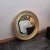 Round mirror designed by Sergio Mazza for Artemide. Refined mirrors with a round shape and built -up bordering with golden...