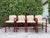 Authentic vintage Loewenstein counter stools featuring sculptural curved arm frames and a rich high-gloss stained wood...