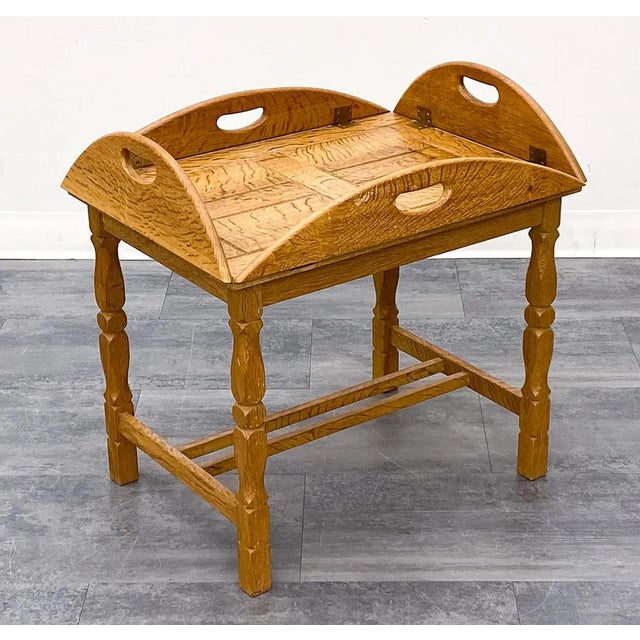 A delightful vintage butlers tray table in solid oak. This particular piece is a Scandinavian take on the butlers table....