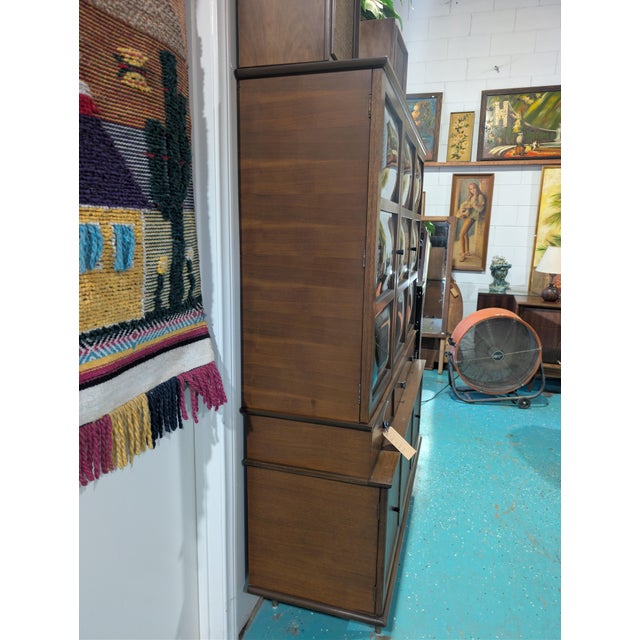 This rare, bubble glass doors, Mid-Century Display Cabinet is in stunning condition! It features three drawers in the...