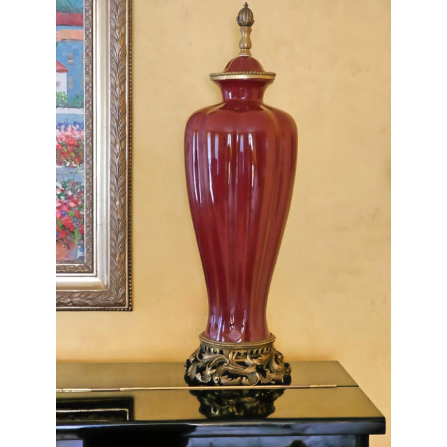 Hollywood Regency Vintage Sang De Boeuf Vases – Pair of Oxblood Red Ceramic Lamp Bases With Bronze Detailing by Daminic For Sale - Image 3 of 12