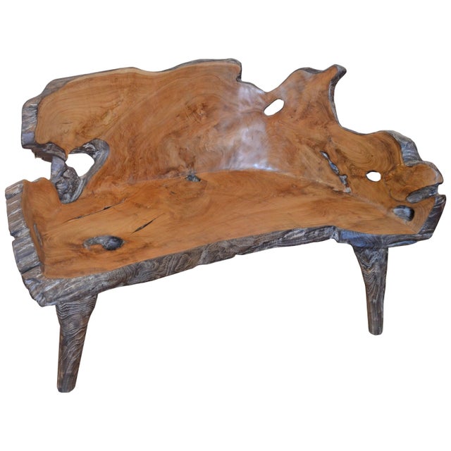 Organic shaped reclaimed teak bench carved from a single root found in the jungle in Sumatra. We added the legs, burnt it...