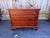 Vintage George II mahogany Chippendale chest of drawers It features stop fluted corner columns and ogee bracket feet,...