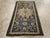 This Early 20th century Caucasian Shirvan rug, measuring 1' 9" x 3' 1", exemplifies the bold geometric artistry for which...