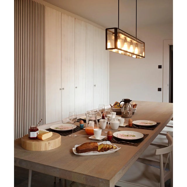 Hanging light with a clear glass structure held in brass frame, sections with dimensions of 15x15mm. The hanging light has...