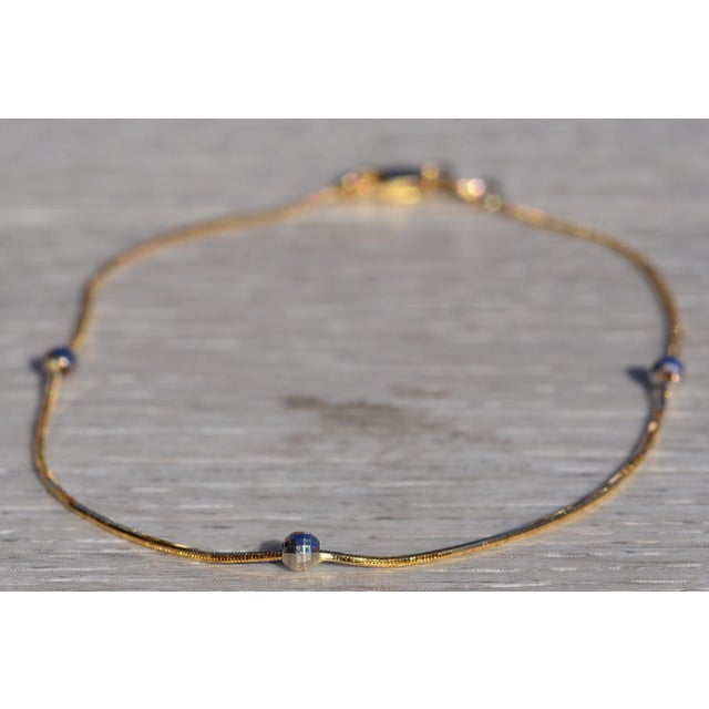 The Aduana: Ladies 14K Two Tone Gold Station Ankle Bracelet. Crafted in 14 karat yellow gold, this ladies' simple anklet...