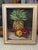 Purchased in France, this is a still life oil painting depicting an arrangement of fruits on a neutral surface against a...