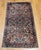 "This elegant vintage Persian Kerman Lavar rug from the early 1900s features a harmonious all-over floral bouquet pattern,...