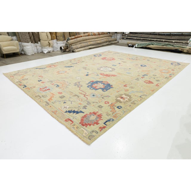 This Modern Oushak style rug combines traditional Turkish design with a contemporary aesthetic. Hand-knotted from 100%...