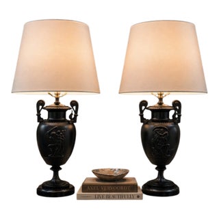 Late 20th Century Neoclassical Black Urn Table Lamps With Figural Relief - a Pair For Sale