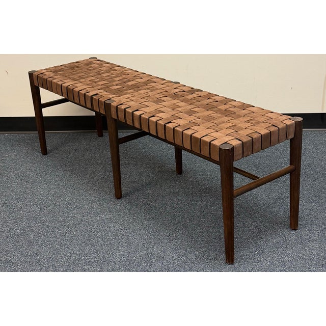 Beautiful Pottery Barn bench featuring a rubberwood frame in a warm Vintage Amber finish and a basketweave seat crafted...