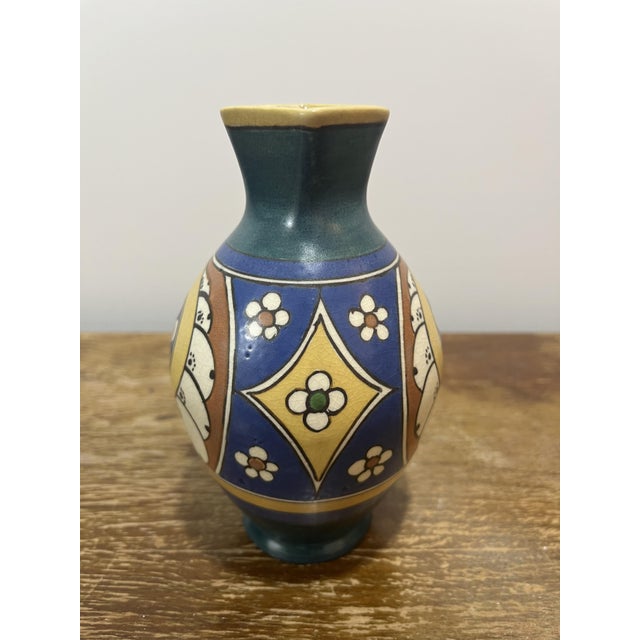 Design & Form: This exceptional vase features a sophisticated and technically demanding silhouette: a generous, globular...