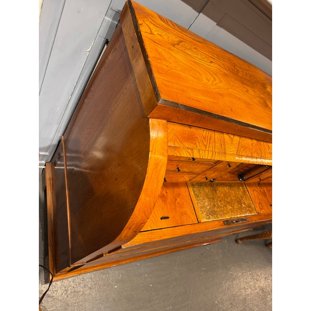 This is an early 19th century Biedermier cylinder Secretary. It was crafted in Germany. It has stunning characteristics,...