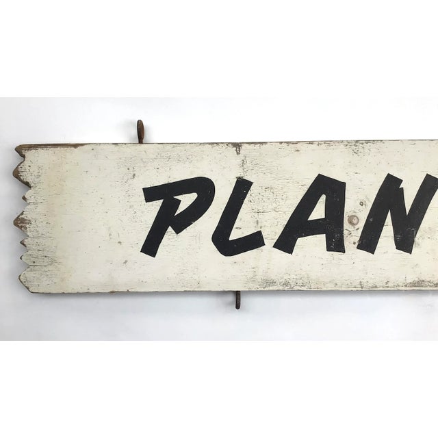 Circa 1950s wood two sided hand lettered black and white Plants sign, has original eye hooks. Height of actual sign is...