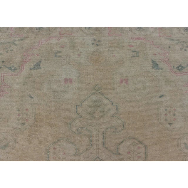Vintage Oushak Rug From Turkey With Muted Colors and Floral Medallion For Sale - Image 9 of 11