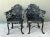 Showcasing ornate classical details, this set of four vintage outdoor armchairs features elaborate lyre-motif backrests...