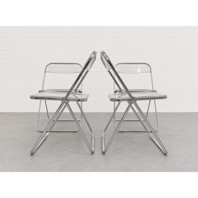Authentic vintage “Plia” lucite and chrome folding chairs designed by Giancarlo Piretti for Castelli, made in Italy circa...
