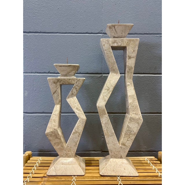 A striking pair of vintage postmodern tessellated stone candlesticks, handcrafted in the Philippines with bold sculptural...
