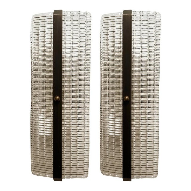 Set of two trasparent diamanted murano glass wall sconces with metal frame on view in brunish- brunito . murano glass with...