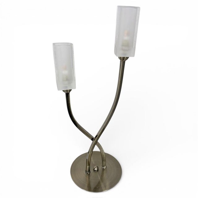 This vintage table lamp is a sculptural twin arm lamp designed to provide warm, ambient glow light in any room. Featuring...