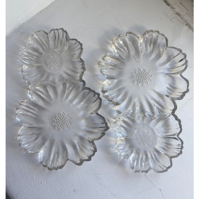 This vintage Hazel-Atlas Capri Double Daisy snack plate is made of heavy clear pressed glass and dates to the 1950s–1960s....