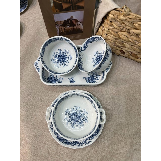 This is a beautiful five-piece porcelain dinnerware set featuring a blue-and-white style. It includes a two-handled soup...