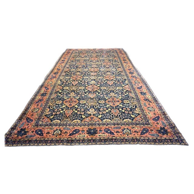 Condition: Antique Circa: 1920s Origin: Persia Design: Lilihan Actual size: 10'9" x 20'0" Colors: Salmon, Orange, Yellow,...