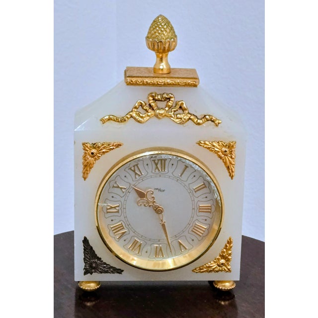 Step into timeless sophistication with this Swiss Imhof desk clock, masterfully crafted from white onyx and adorned with...
