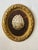 This striking decorative wall plaque features a lustrous natural abalone shell mounted against a rich wood backing and...