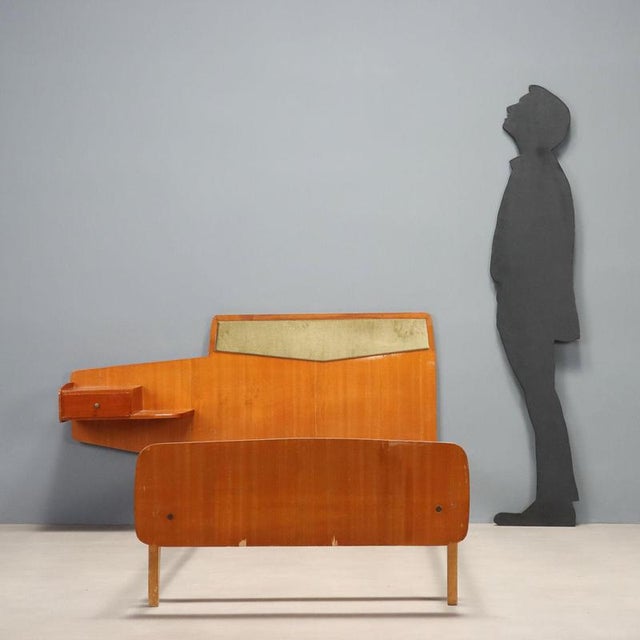Single bed from the 1960s made of teak wood, featuring a functional design and clean lines typical of the period. The...
