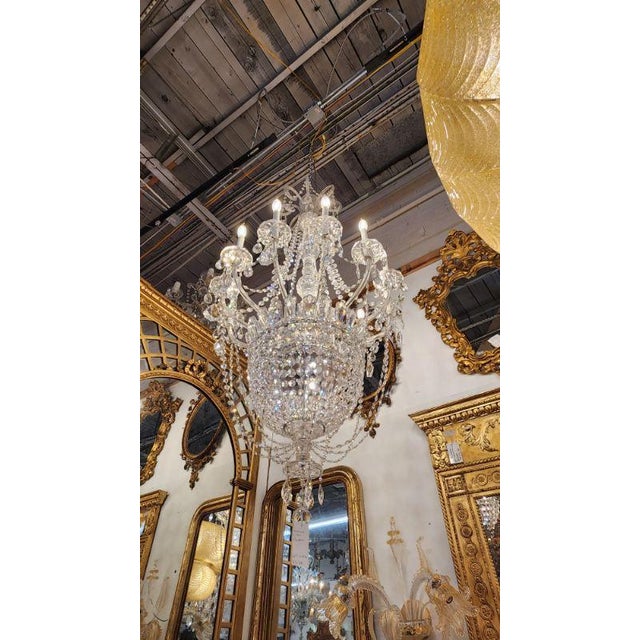 This listing features a gorgeous Swarvoski basket chandelier, that would brighten any room. Unmarked