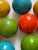 12 Pcs Vintage enamelled polychrome on wood balls. 4” diameter. Carpet balls or garden balls. Great colourful decoration.