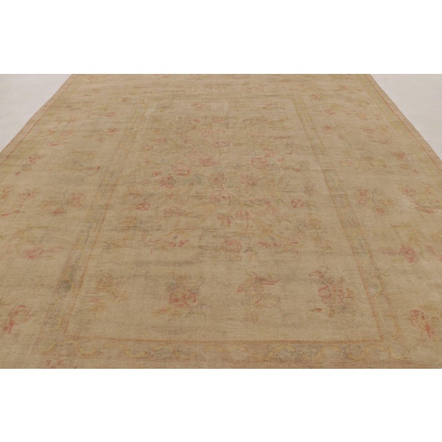 Made with hand-knotted wool, this 12x16 oversized rug, it is a brand-new production that functions as a soft, romantic...