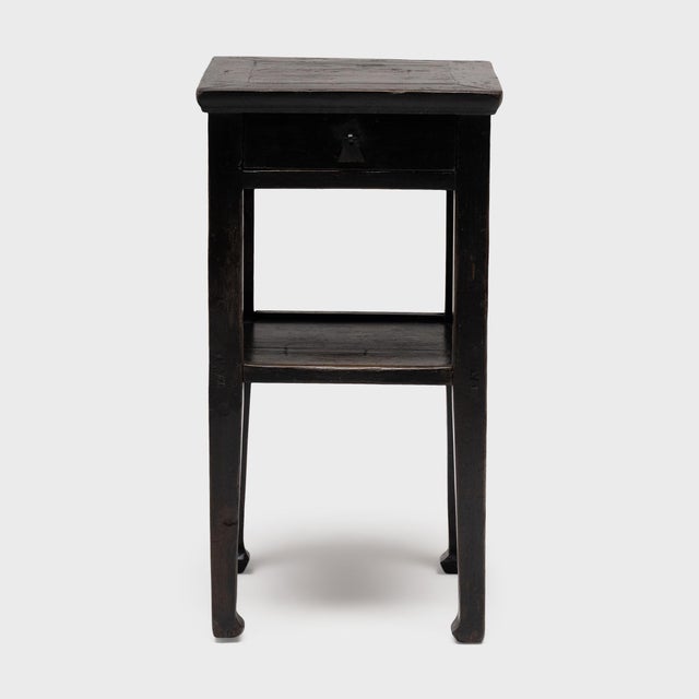 This antique Chinese display table dates to the early 20th century and would have been used as a pedestal for floral...