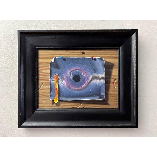 Wormhole presents a surreal exploration of cosmic themes, featuring a vivid depiction of a black hole emerging from a...