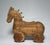 Primitive in style, folk art in design is the hand-carved wooden horse figurine. Believed to be modeled after a Marwari...