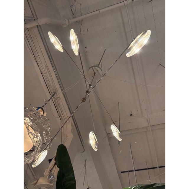 Design Plus Gallery presents the Gaia Chandelier from OCHRE. This striking chandelier features six solid glass drops...